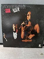 Front cover of Sonny & Cher Live LP with performers image and title