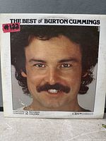 Front cover of The Best of Burton Cummings double LP showing title, portrait artwork and label markings