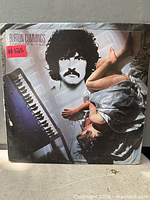 Front cover of Burton Cummings "Dream of a Child" LP showing sleeve artwork and wear