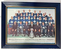 Full view of framed team print showing players and trophy