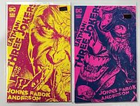 Front view of both variant comics in bags and boards