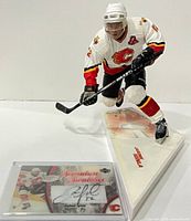 Figure and autographed patch card together