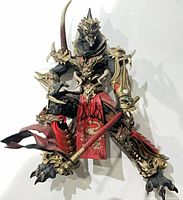 Front view of Mandarin Spawn figure holding staff handle