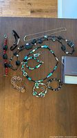 All jewelry pieces laid out on table
