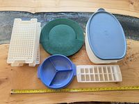 All items grouped: turkey keeper with lid, six grid trays, blue divided tray, green tray, white ice cube tray