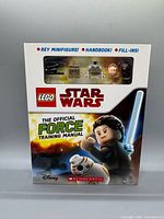 Front cover showing LEGO Star Wars branding, Rey minifigure in sealed blister with accessories