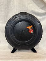Front view of tire-shaped Hot Wheels Super Rally Case with sticker visible