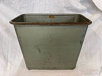 Front view of pale green Lawson steel wastebasket