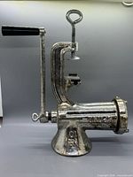 Right side view showing full grinder, handle, and clamp mechanism