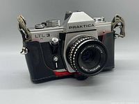 Front view of Praktica LTL 3 with Domiplan 50mm lens and leather half-case