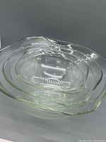 Nested view of all three clear Pyrex bowls showing rim shape and size gradation