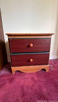Front view showing entire nightstand with two drawers closed