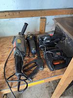 all four power tools on workbench