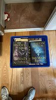 Crate top view showing Born of Legend and Bad Moon Rising hardcovers