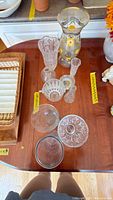 Group view of all pressed glass pieces on table