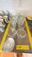 Lot overview showing all dessert bowls and stacked saucers