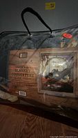 Front of packaged blanket showing label with eagle image and branding information