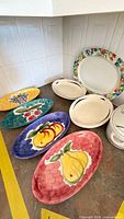 Assortment of platters, plates and casserole on countertop