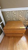 Front and top view of light oak nightstand showing overall appearance