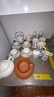 Overview of all dinnerware pieces on countertop