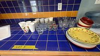 Overview of dinnerware and glassware on countertop