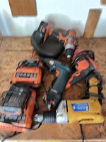 Group view of all drills and chargers on work surface