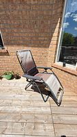 Chair fully reclined on deck shows overall design and condition