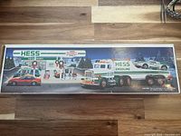 Side panel of box showing Hess truck, race car, and station artwork