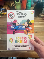 Front of Color Brain Disney Edition box showing Mickey and Minnie artwork and age recommendation 8+