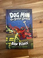 Front cover of Dog Man: The Scarlet Shedder hardcover