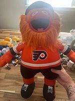 Front view of large Gritty plush showing jersey logo and overall appearance