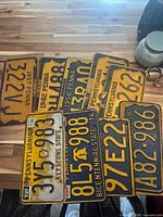 Front view of all license plates showing serials and state/year markings