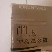 Front of sealed package showing Ikea branding, product name and abstract stripe design
