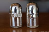 Front view showing belt buckle detail on both shakers