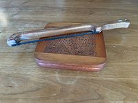 Cheese board and bread slicer together on tabletop