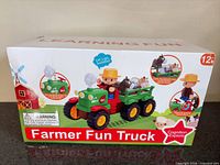 Front of box showing toy, branding, age rating