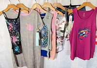 Group of seven size 10/12 garments on hangers