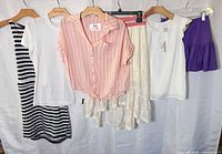 All six garments on hangers for full view
