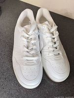 Top view of pair showing new condition, laces, tags