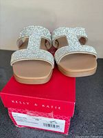 Front view of rhinestone slide sandals on box