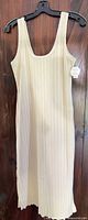 Full view of cream ribbed tank dress on hanger