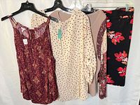 Group shot of all four garments on hangers