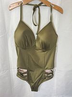 Front view of olive one-piece swimsuit on hanger