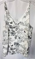 Full view of floral tank blouse on hanger