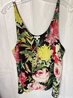 Front view of floral Reitmans tank showing pattern, neckline, attached tag