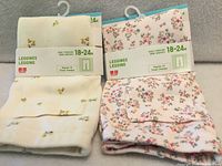 Both packaged leggings front view showing designs and size labels