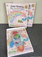Front view showing two boxed toys and one loose sample