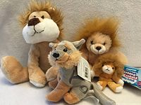 Group shot of four plush animals