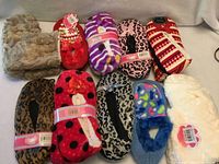 Group shot of all ten slipper pairs laid out