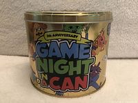 Front of tin showing Game Night In A Can 5th Anniversary logo